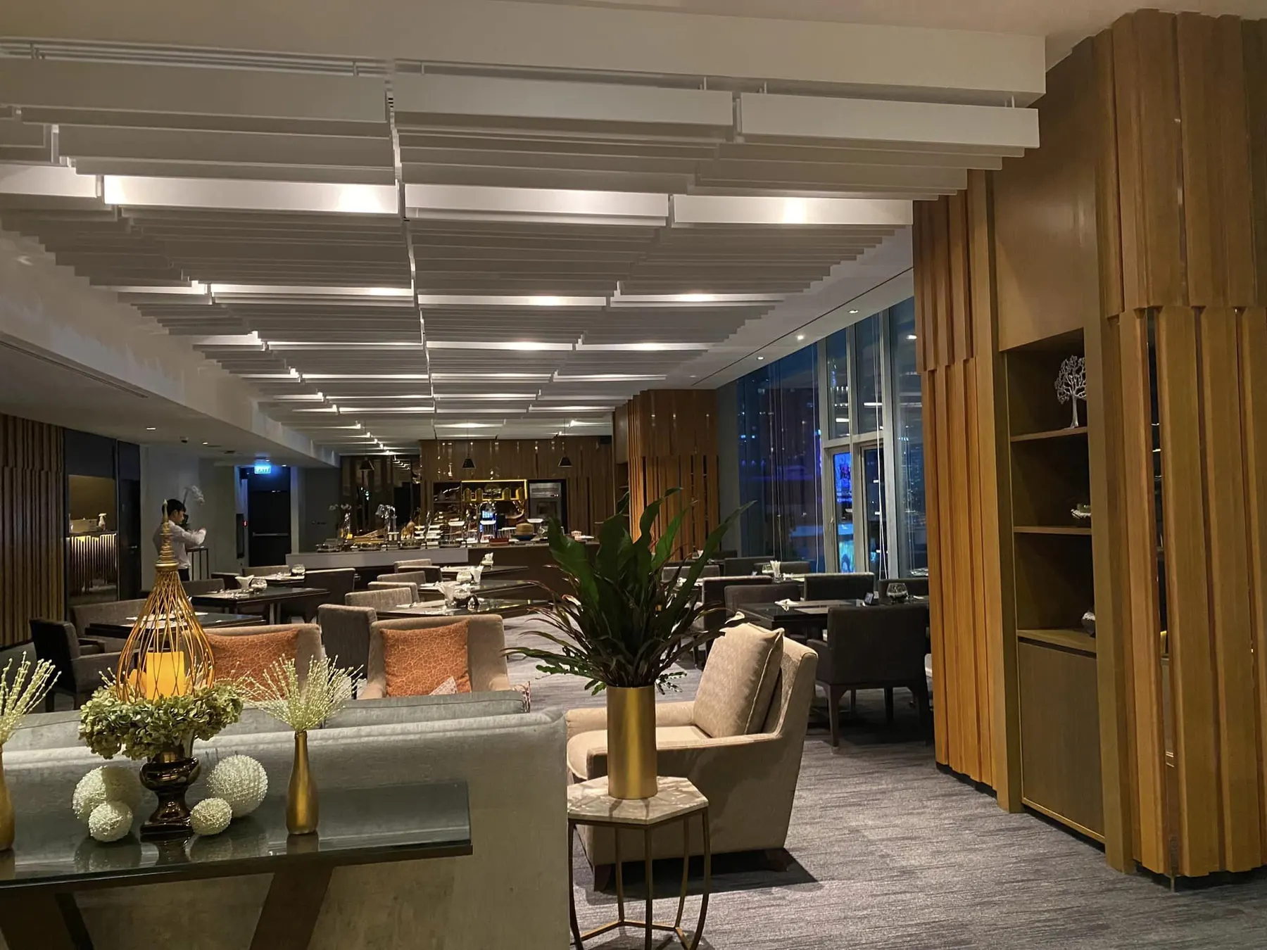 Executive Lounge: loose seating along the window facing the city