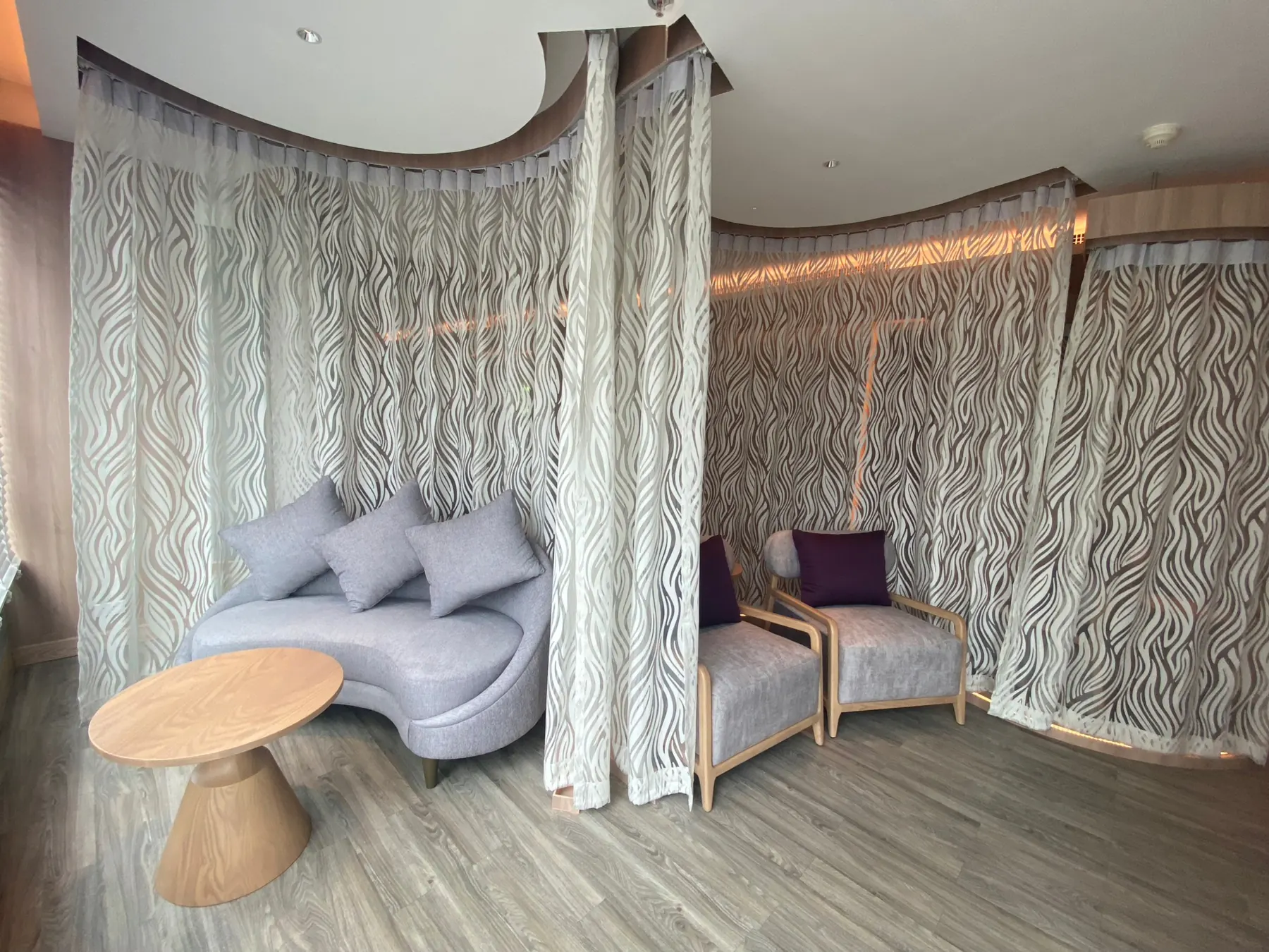 Maai Spa: a waiting alcove inside a circle of patterned sheer curtain
