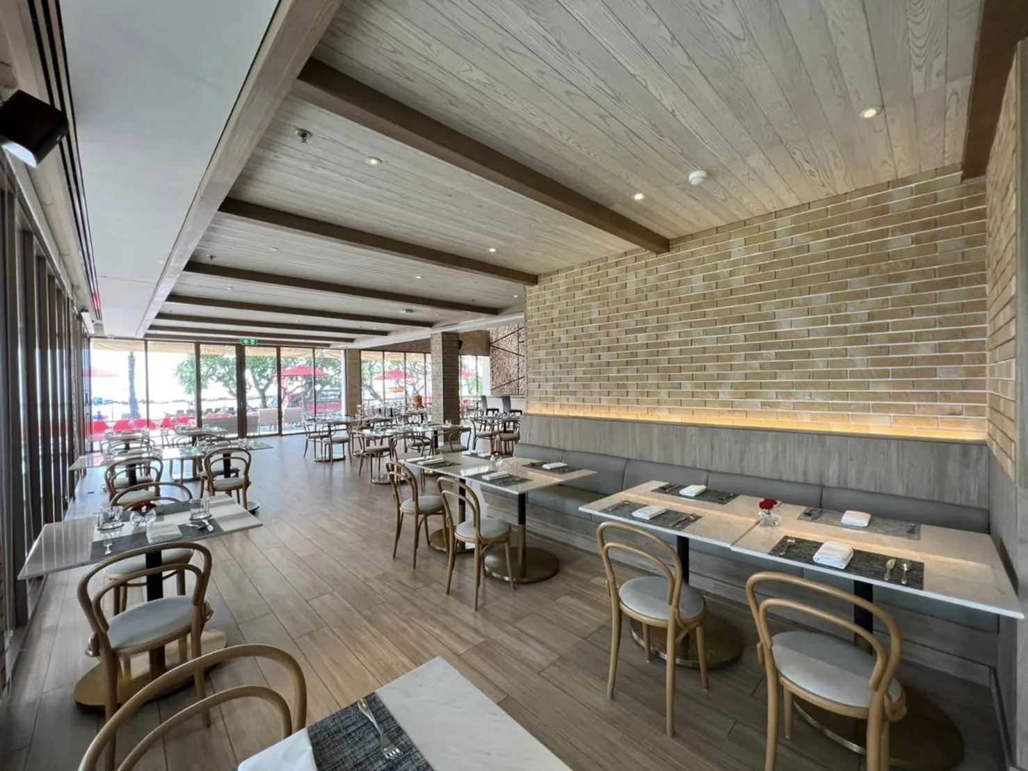 Prego: the double-height dining room with the wood-fired oven and the marble counter