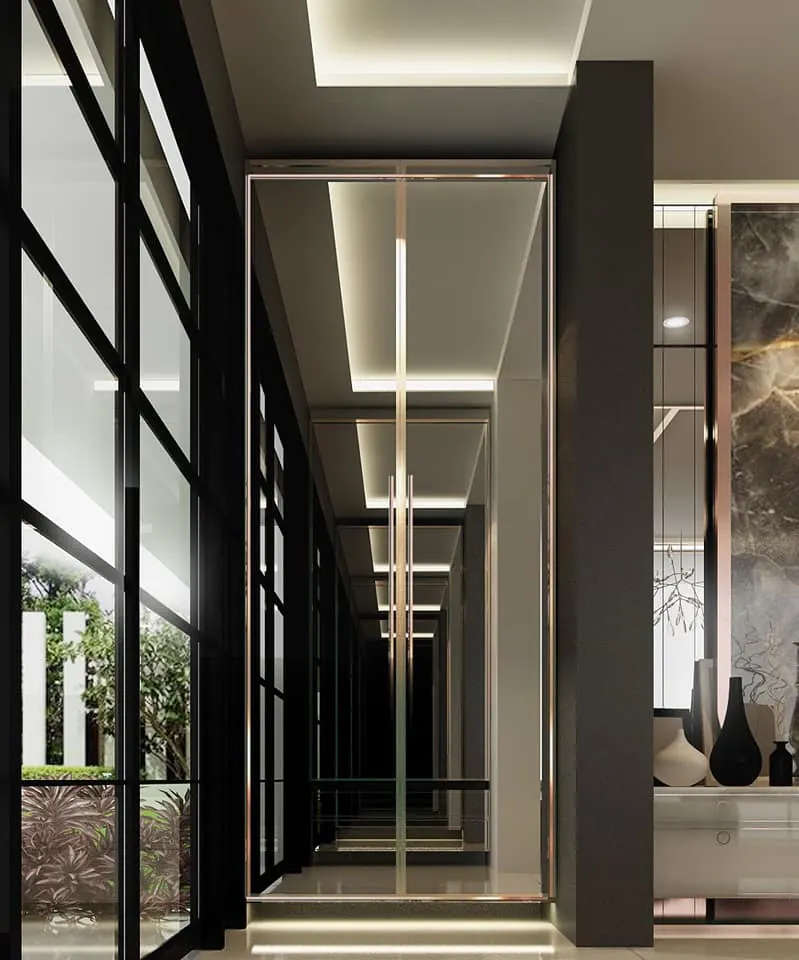 Settasiri: entrance corridor with a bronze-framed glass door and mirrored walls